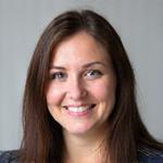 Portrait of Aoife Murphy, Lead Cabinet Maker, smiling confidently.